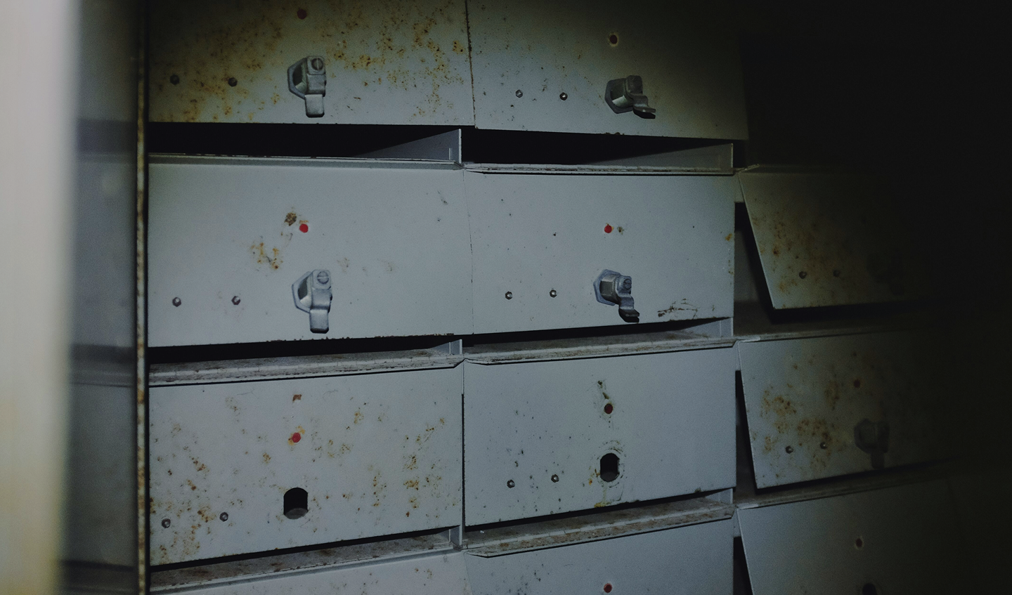 Table littered with documents and photos